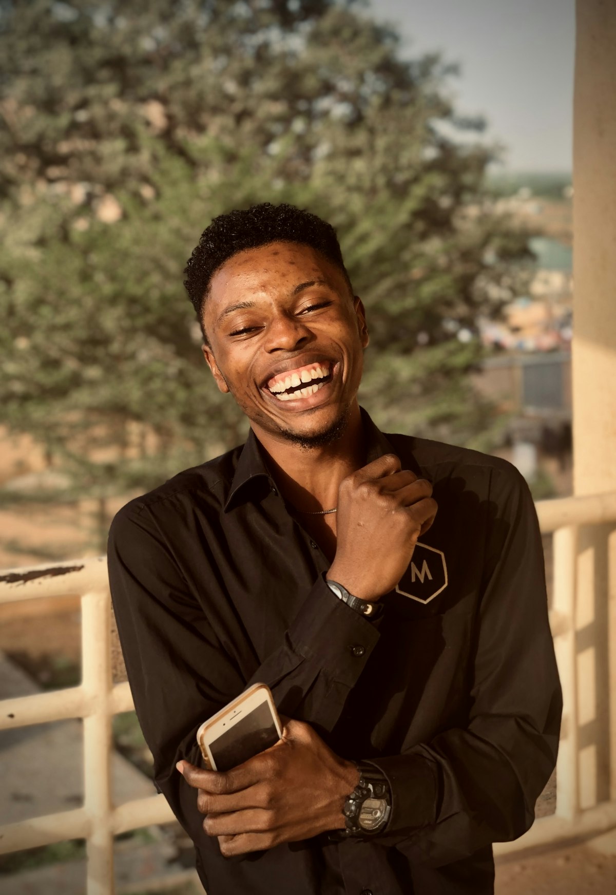 A job seeker laughing after getting a job alert from Talentta on WhatsApp